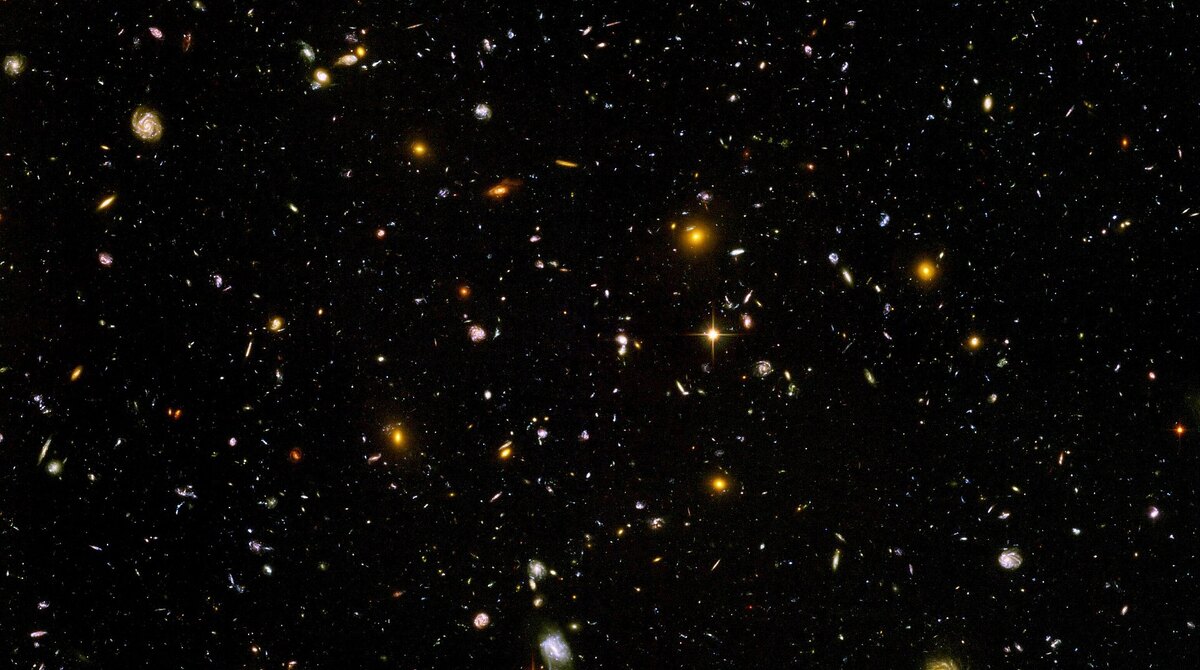 Hubble Ultra Deep Field image showing thousands of distant galaxies