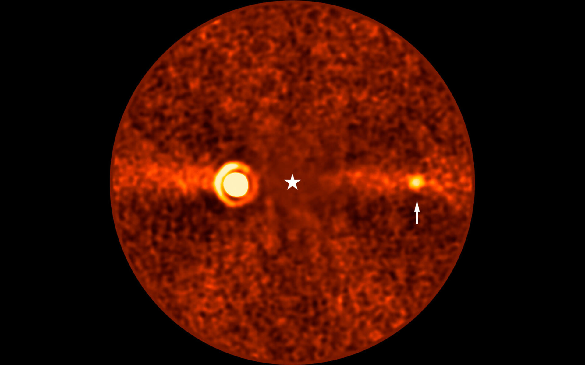 VLT/ERIS image of Beta Pictoris showing the three planets. Beta Pictoris b is the bright source to the left. Beta Pictoris d, indicated with an arrow, is the newly discovered faint planet. The star at center has been subtracted.