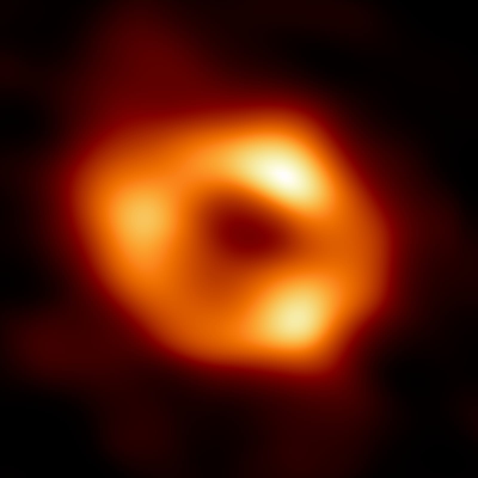 The first image of Sagittarius A*, the supermassive black hole at the center of the Milky Way, showing a ring of hot gas around a dark central shadow. The image is an average of thousands of snapshots because the source changes on timescales of minutes.