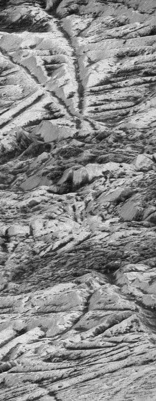 The highest-resolution mosaic of Europa's surface captured by NASA's Galileo spacecraft, showing intricate ridges, cracks, and dark lineae crisscrossing the icy crust of Jupiter's ocean moon.