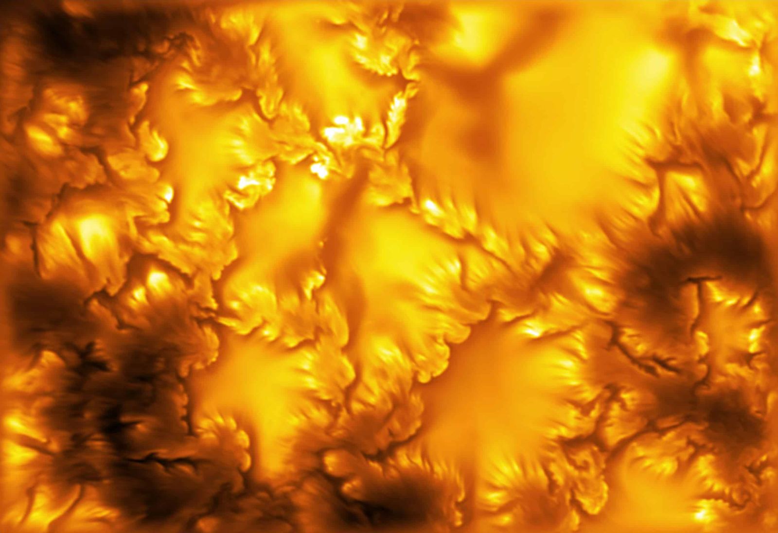 The solar photosphere at 416 nm imaged by the Daniel K. Inouye Solar Telescope, showing bright bubbling granules and dark lanes, with small swirls and fine striations along the edges of dark magnetic structures. Credit: NSF/NSO/AURA/MPS.