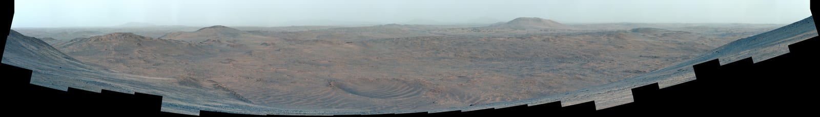 The Martian surface beyond Jezero Crater photographed by NASA's Perseverance rover, an enhanced-color mosaic taken from the crater rim where the rover collected a sample called Silver Mountain. Credit: NASA/JPL-Caltech/ASU/MSSS.