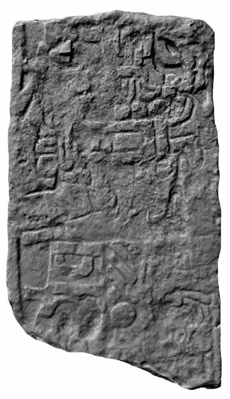 Black and white three-dimensional scan of a carved stone stela fragment from Minanbé, showing hieroglyphic text and a carved figure.