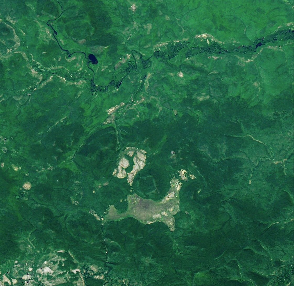 Annotated satellite map of the Tunguska region in Russia, showing healthy green pine forests, marshes, and rivers, with a marker labeled epicenter dated June 30, 1908, a possible trajectory arrow, and Lake Cheko labeled to the north. Credit: NASA Earth Observatory, Landsat 8 OLI, July 6, 2024.